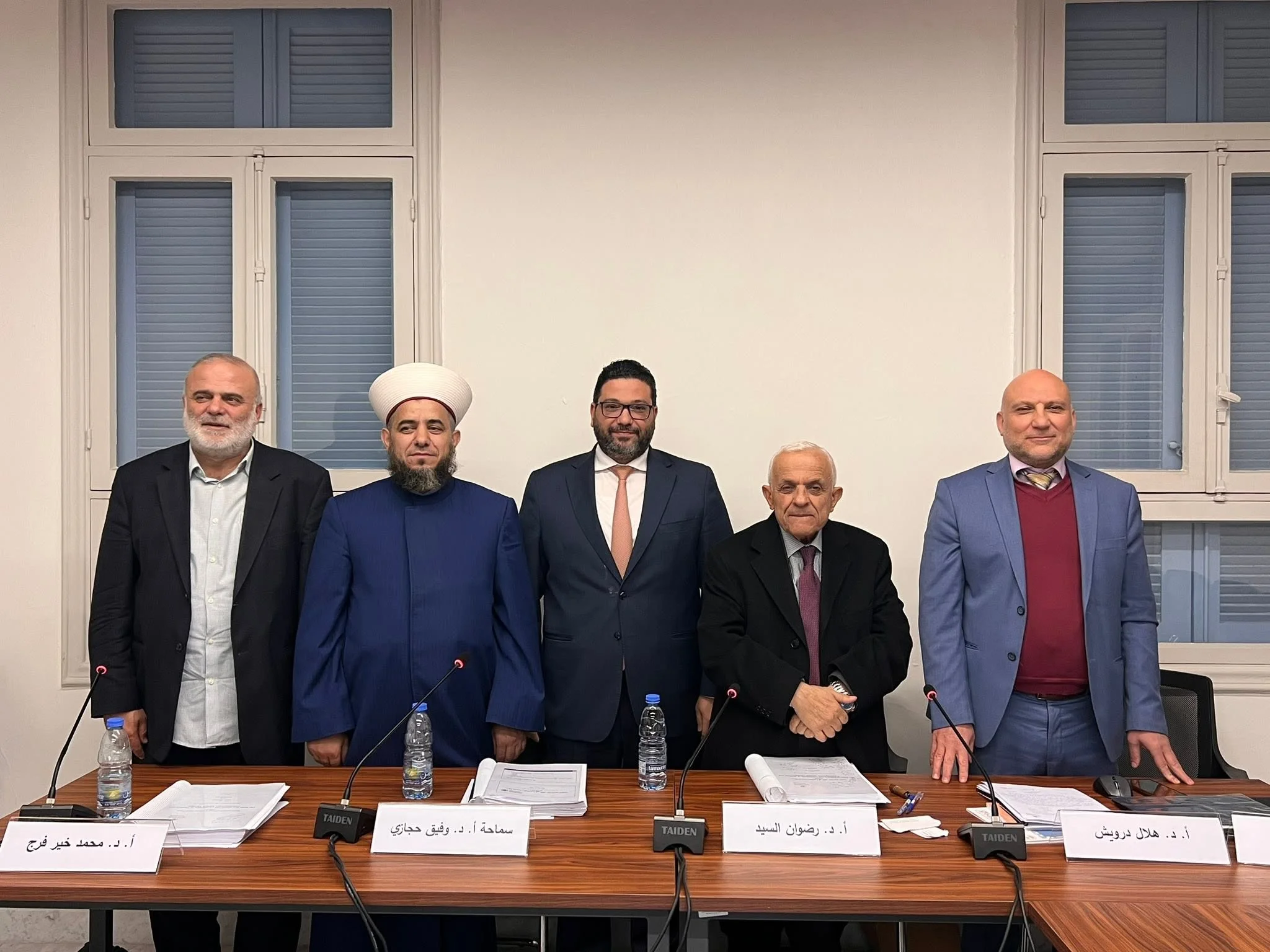 With the academic committee following the PhD defense